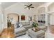 Bright living room with hardwood floors, high ceilings, and a large, comfortable gray sectional sofa at 125 Whiterock Dr, Mount Holly, NC 28120