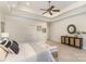 Spacious main bedroom features trey ceiling, ceiling fan, neutral decor, and sitting area at 125 Whiterock Dr, Mount Holly, NC 28120