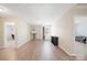 Bonus room featuring neutral paint, a large window and light colored hardwood floors at 12820 Settlers Trail Ct, Charlotte, NC 28278