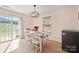 Bright dining area with natural light and access to the backyard at 12820 Settlers Trail Ct, Charlotte, NC 28278