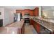 Modern kitchen with stainless steel appliances, a central island, and ample counter space at 12820 Settlers Trail Ct, Charlotte, NC 28278