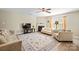 Inviting living room with a cozy fireplace, large windows, and comfortable seating at 12820 Settlers Trail Ct, Charlotte, NC 28278