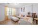 Inviting living room with large windows, hardwood floors, and comfortable seating at 12820 Settlers Trail Ct, Charlotte, NC 28278