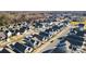 An aerial view of a residential neighborhood, showcasing well-maintained homes and tree-lined streets at 136 Kingston Dr, Locust, NC 28097