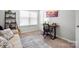 Bedroom featuring neutral paint, carpet, and a wooden desk area at 136 Kingston Dr, Locust, NC 28097