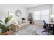 Bright bedroom showcasing a comfortable sofa and modern decor at 136 Kingston Dr, Locust, NC 28097