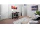 Bedroom featuring neutral paint, carpet, and a wooden desk area at 136 Kingston Dr, Locust, NC 28097