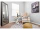 Cozy reading nook showcasing a comfortable accent chair, round rug and soft natural light at 136 Kingston Dr, Locust, NC 28097