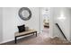 Neutral hallway with bench seating leads to the bedroom at 136 Kingston Dr, Locust, NC 28097