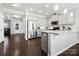 Modern kitchen with stainless steel appliances, granite countertops, a kitchen island, and dark wood floors at 136 Kingston Dr, Locust, NC 28097
