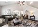 Open living room with high ceilings, stylish furnishings, a comfortable sofa, and seamless flow into other spaces at 136 Kingston Dr, Locust, NC 28097