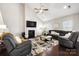 Spacious living room featuring a fireplace, sectional sofa, and modern decor at 136 Kingston Dr, Locust, NC 28097