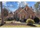Well-maintained brick and stone home featuring neat landscaping and shutters for enhanced curb appeal at 170 Anniston Way, Davidson, NC 28036