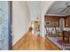 Grand foyer boasts gleaming hardwood floors, arched entryway, and staircase, creating a luxurious first impression at 170 Anniston Way, Davidson, NC 28036