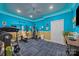 Home gym equipped with treadmill, weight machine, and blue accent lighting at 170 Anniston Way, Davidson, NC 28036