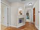 Hallway featuring hardwood floors, a decorative niche with display items, and doorways leading to other rooms at 170 Anniston Way, Davidson, NC 28036