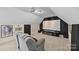 Home theater including projector, screen, and surround sound within the finished bonus room at 170 Anniston Way, Davidson, NC 28036