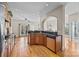 Open-concept kitchen featuring a breakfast bar and seamless flow into the dining and living areas at 170 Anniston Way, Davidson, NC 28036
