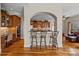 Open kitchen featuring breakfast bar, stainless steel appliances, and seamless access to adjacent rooms at 170 Anniston Way, Davidson, NC 28036