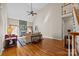 Spacious living room with hardwood floors, vaulted ceiling, stone fireplace, and staircase at 170 Anniston Way, Davidson, NC 28036