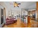 Inviting living space open to a dining area with a kitchen featuring a breakfast bar at 170 Anniston Way, Davidson, NC 28036