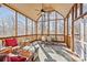 Enclosed porch with outdoor furniture, ceiling fan, and view of the backyard at 170 Anniston Way, Davidson, NC 28036