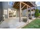 Spacious back patio featuring concrete base and wooden structural support at 1932 Catkin Ln, Charlotte, NC 28205
