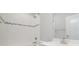 Cozy bathroom featuring tiled shower and floors, with a white sink and cabinets at 1932 Catkin Ln, Charlotte, NC 28205