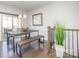 Modern dining room featuring hardwood floors, stylish furniture, and natural light from sliding glass doors at 1932 Catkin Ln, Charlotte, NC 28205