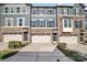 Charming townhome featuring a stone facade, three stories, and a one car garage at 1932 Catkin Ln, Charlotte, NC 28205