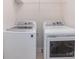 View of laundry room equipped with white washer and dryer at 1932 Catkin Ln, Charlotte, NC 28205