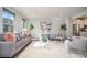 Spacious living room with modern decor, comfortable seating, and large windows at 1932 Catkin Ln, Charlotte, NC 28205