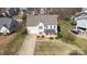 Stunning aerial view of a two-story home with a red front door, landscaped yard, and paved driveway at 2010 Hollyhedge Ln, Indian Trail, NC 28079