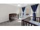 Well-lit Bedroom with two cribs, blue curtains and white furniture at 2010 Hollyhedge Ln, Indian Trail, NC 28079