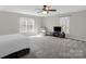 Carpeted bedroom with several windows, fan and recessed lighting at 2010 Hollyhedge Ln, Indian Trail, NC 28079