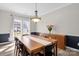 Bright dining room with hardwood floors, wainscoting and chandelier lighting at 2010 Hollyhedge Ln, Indian Trail, NC 28079