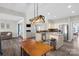 Bright kitchen with stainless steel appliances, granite counters, and open layout to the living room at 2010 Hollyhedge Ln, Indian Trail, NC 28079
