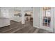Open concept kitchen and living room with modern appliances and luxury vinyl plank flooring at 2010 Hollyhedge Ln, Indian Trail, NC 28079