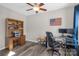 Office with wood floors features a ceiling fan, desk, and an American Flag on the wall at 2010 Hollyhedge Ln, Indian Trail, NC 28079