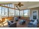 Comfortable screened-in porch with contemporary furnishings and ceiling fan at 2010 Hollyhedge Ln, Indian Trail, NC 28079