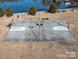A large basketball court with a beautiful waterfront view for community entertainment and activity at 2017 Bridleside Dr, Indian Trail, NC 28079
