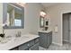 Bathroom featuring double vanity with framed mirrors, modern fixtures, and neutral color palette at 2017 Bridleside Dr, Indian Trail, NC 28079