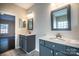 Bathroom with dual sinks, gray cabinets, and marble countertops at 2017 Bridleside Dr, Indian Trail, NC 28079