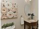 Powder room featuring an decorative painting, oval mirror, and a unique vessel sink on a stylish vanity at 2017 Bridleside Dr, Indian Trail, NC 28079