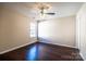 Comfortable bedroom featuring hardwood floors, a ceiling fan, and a bright window at 2017 Bridleside Dr, Indian Trail, NC 28079