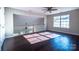 An inviting bonus room with hardwood floors, natural light, and ceiling fan at 2017 Bridleside Dr, Indian Trail, NC 28079