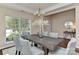 Dining room featuring a large window, modern chandelier, and seating for six at 2017 Bridleside Dr, Indian Trail, NC 28079
