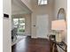 Bright foyer with hardwood floors and a large window letting in natural light, with a view to the dining area at 2017 Bridleside Dr, Indian Trail, NC 28079