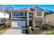Charming two-story home featuring a brick facade, two-car garage, and well-maintained landscaping at 2017 Bridleside Dr, Indian Trail, NC 28079