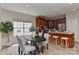 Bright eat-in kitchen features an island with bar stool seating and stainless steel appliances at 2017 Bridleside Dr, Indian Trail, NC 28079